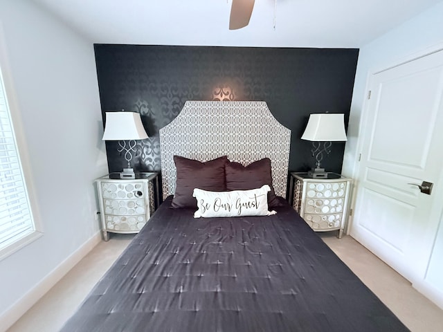 129 Ethel Dr, Roscommon, MI 48653 - bedroom featuring an accent wall, carpet flooring, ceiling fan, and wallpapered walls