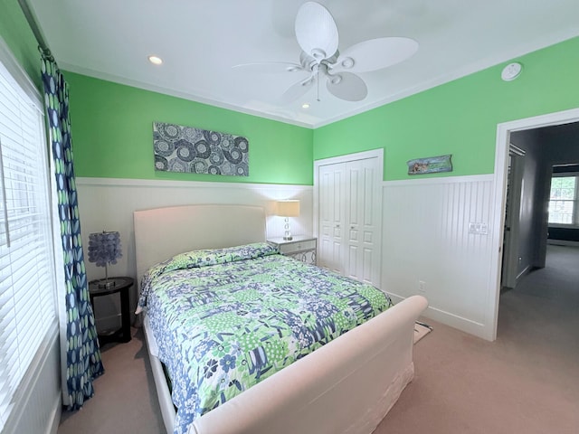 129 Ethel Dr, Roscommon, MI 48653 - bedroom featuring wainscoting, carpet floors, a closet, and a ceiling fan