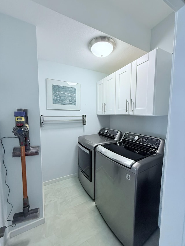 129 Ethel Dr, Roscommon, MI 48653 - laundry area featuring cabinet space and washer and dryer