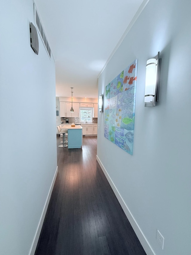 129 Ethel Dr, Roscommon, MI 48653 - hall with baseboards and dark wood finished floors