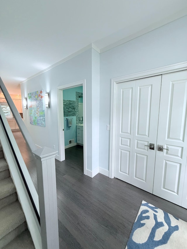 129 Ethel Dr, Roscommon, MI 48653 - stairs with wood finished floors and crown molding