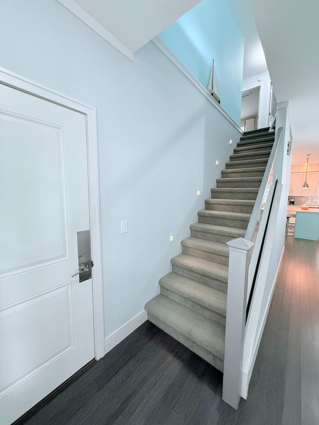 129 Ethel Dr, Roscommon, MI 48653 - staircase with wood finished floors and baseboards