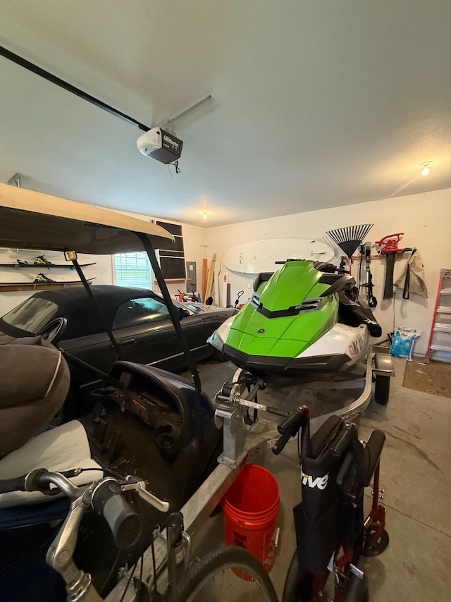 129 Ethel Dr, Roscommon, MI 48653 - garage with a garage door opener