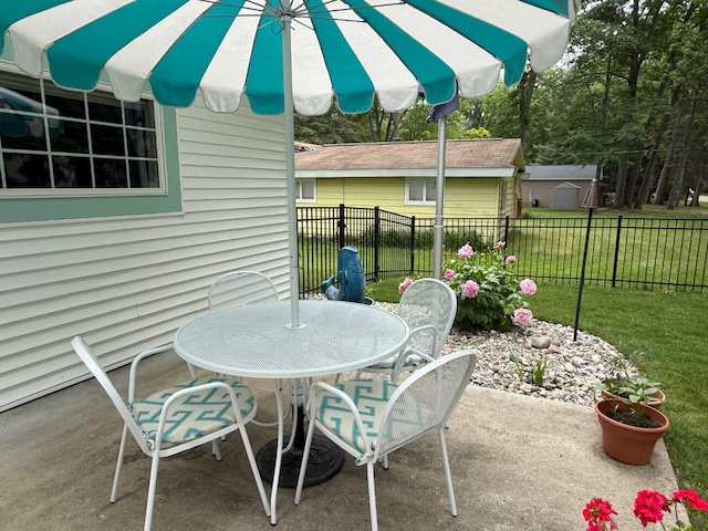 129 Ethel Dr, Roscommon, MI 48653 - view of patio featuring outdoor dining space
