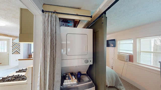 213 Devonshire Dr, Prudenville, MI 48651 - washroom with a textured ceiling, stacked washer / dryer, cooling unit, and ornamental molding
