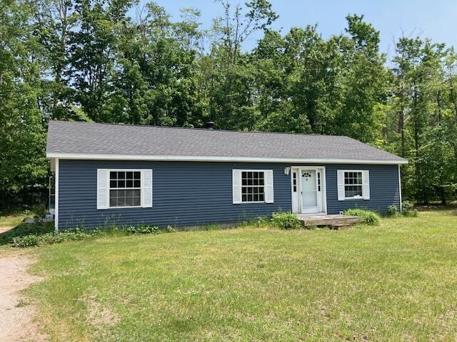 2966 Mitchell Dr, Cheboygan, MI 49721 - ranch-style home featuring a front lawn