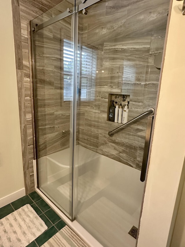 7984 US-23, Cheboygan, MI 49721 - full bath with tile patterned floors and a stall shower