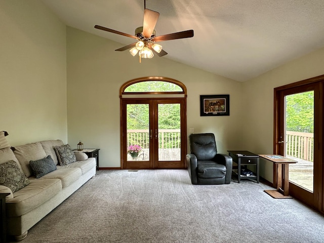 7984 US-23, Cheboygan, MI 49721 - carpeted living area featuring lofted ceiling and ceiling fan