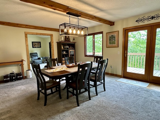7984 US-23, Cheboygan, MI 49721 - dining area featuring beamed ceiling, a textured ceiling, and carpet flooring