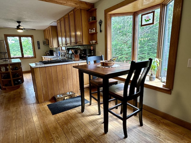 7984 US-23, Cheboygan, MI 49721 - dining space featuring a ceiling fan and light wood finished floors