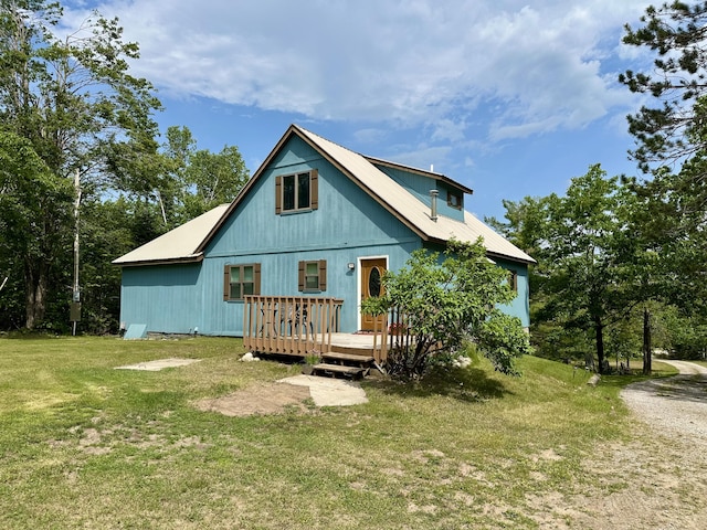 7984 US-23, Cheboygan, MI 49721 - back of house with a lawn, a deck, and a metal roof