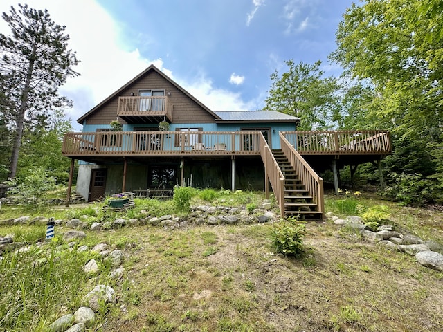 7984 US-23, Cheboygan, MI 49721 - back of house featuring a wooden deck and stairs