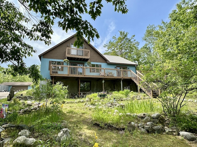 7984 US-23, Cheboygan, MI 49721 - rear view of property with a wooden deck, stairs, and a balcony