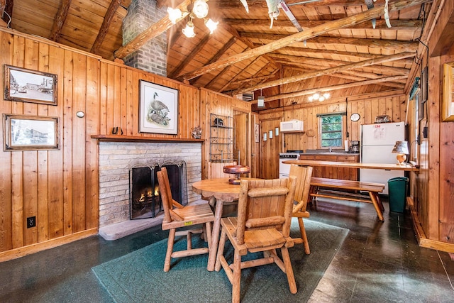 451 Gower Ln, Cheboygan, MI 49721 - dining room featuring wooden walls, wood ceiling, and a brick fireplace