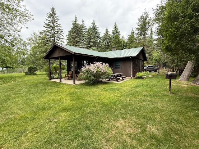 451 Gower Ln, Cheboygan, MI 49721 - view of grassy yard featuring a patio