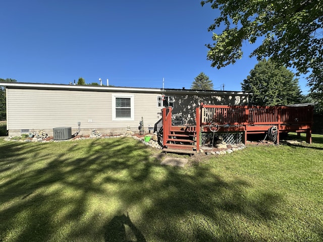 1632 Lakeview Dr, Alpena, MI 49707 - back of house with a wooden deck and a yard