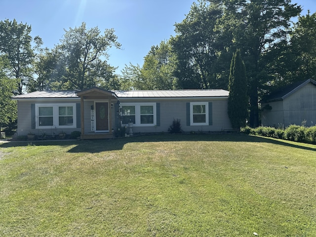 1632 Lakeview Dr, Alpena, MI 49707 - view of front of house with a front lawn and a metal roof