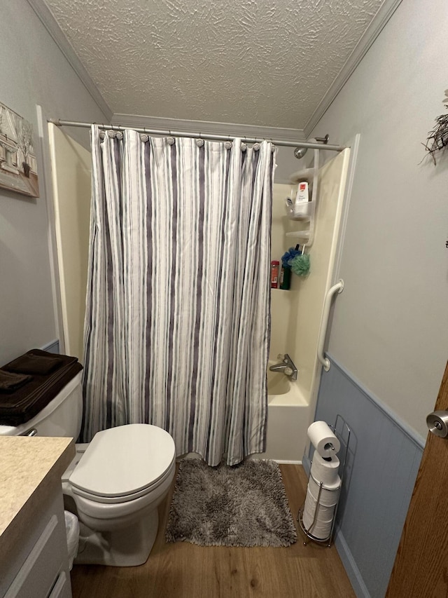 1632 Lakeview Dr, Alpena, MI 49707 - bathroom featuring a textured ceiling, wood finished floors, shower / bathtub combination with curtain, and vanity