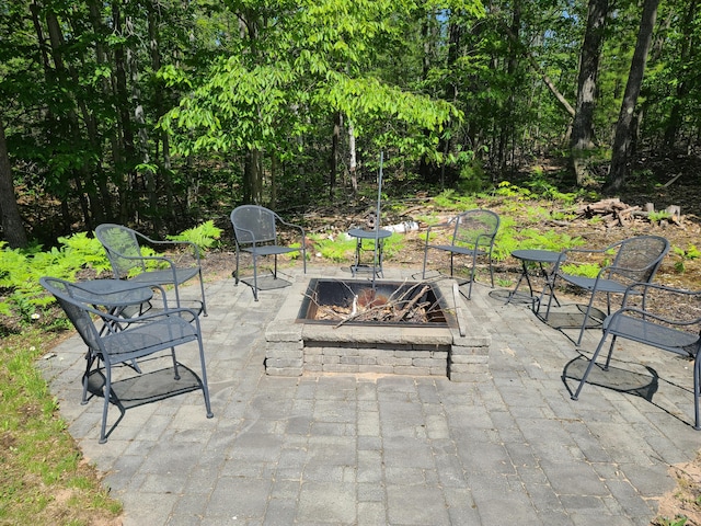 5825 Arawak Pass, Gaylord, MI 49735 - view of patio / terrace with a fire pit