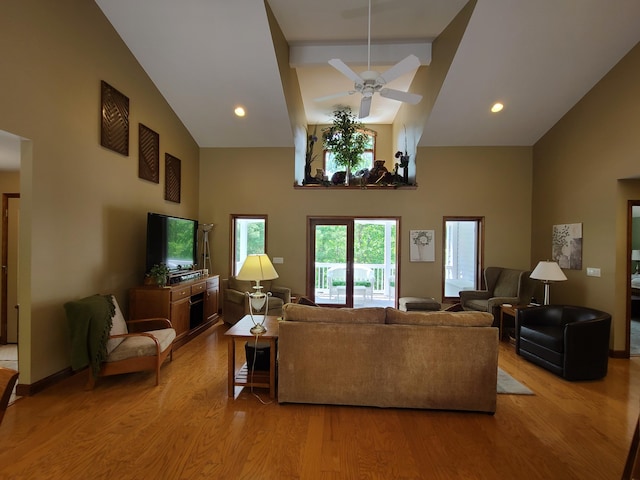 5825 Arawak Pass, Gaylord, MI 49735 - living room featuring high vaulted ceiling, wood finished floors, and ceiling fan