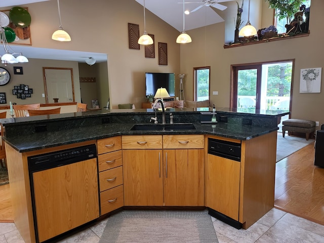 5825 Arawak Pass, Gaylord, MI 49735 - kitchen featuring dishwashing machine, high vaulted ceiling, open floor plan, a ceiling fan, and dark stone countertops