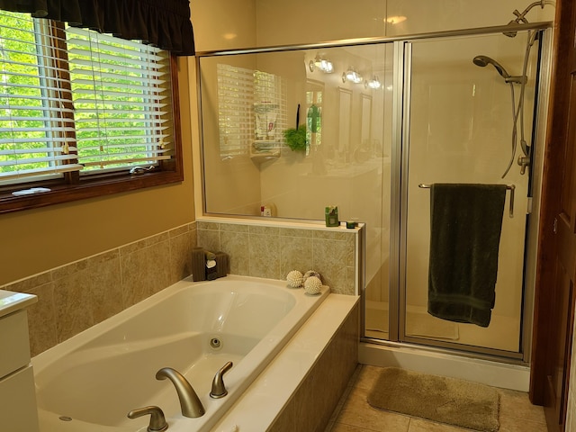 5825 Arawak Pass, Gaylord, MI 49735 - full bathroom with a whirlpool tub, a stall shower, and tile patterned flooring