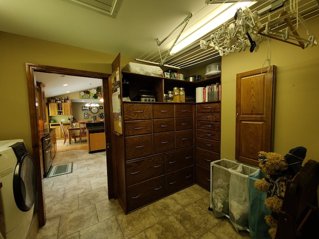 5825 Arawak Pass, Gaylord, MI 49735 - laundry area with washer / clothes dryer and light stone finish floors