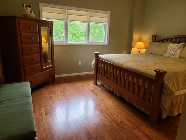 5825 Arawak Pass, Gaylord, MI 49735 - bedroom featuring wood finished floors and baseboards