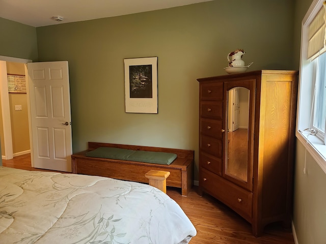 5825 Arawak Pass, Gaylord, MI 49735 - bedroom featuring wood finished floors and baseboards