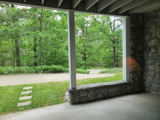 5825 Arawak Pass, Gaylord, MI 49735 - view of patio featuring a wooded view