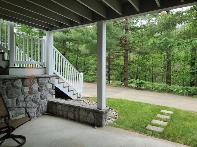 5825 Arawak Pass, Gaylord, MI 49735 - view of patio / terrace featuring stairs and a forest view