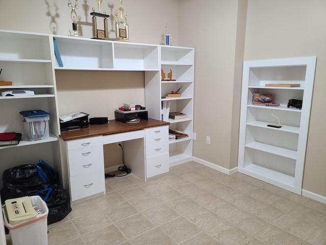 5825 Arawak Pass, Gaylord, MI 49735 - home office with light tile patterned flooring and built in study area