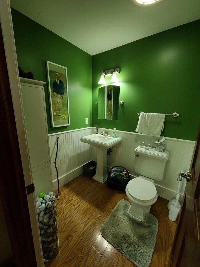 5825 Arawak Pass, Gaylord, MI 49735 - bathroom with a wainscoted wall and wood finished floors
