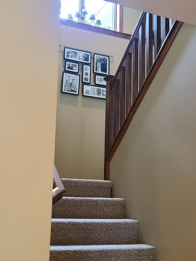 5825 Arawak Pass, Gaylord, MI 49735 - staircase with a chandelier