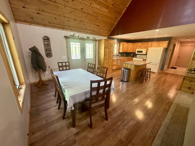 18440 Hardwood Trl, Hillman, MI 49746 - dining area featuring light wood-type flooring, high vaulted ceiling, wood ceiling, and recessed lighting