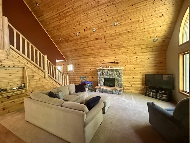 18440 Hardwood Trl, Hillman, MI 49746 - living room with wooden ceiling, high vaulted ceiling, stairs, a fireplace, and carpet floors