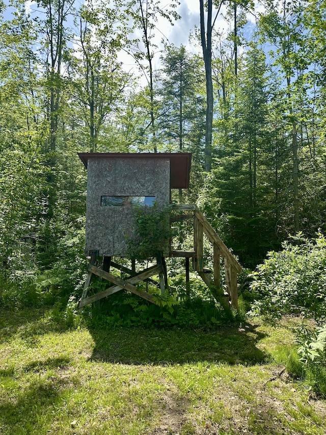 18440 Hardwood Trl, Hillman, MI 49746 - view of outbuilding featuring a forest view