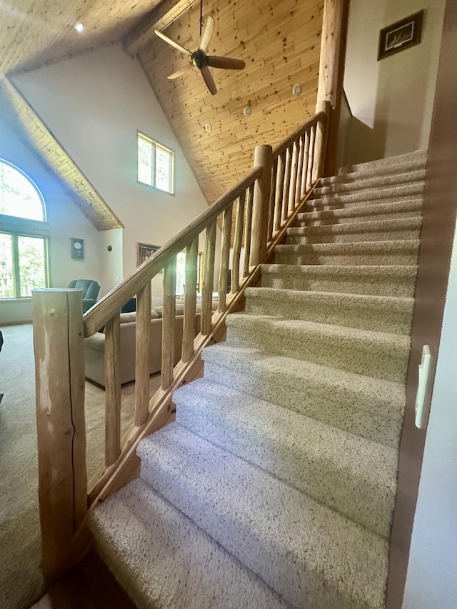 18440 Hardwood Trl, Hillman, MI 49746 - staircase featuring ceiling fan, plenty of natural light, high vaulted ceiling, carpet, and beamed ceiling