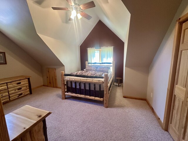 18440 Hardwood Trl, Hillman, MI 49746 - carpeted bedroom with lofted ceiling and ceiling fan