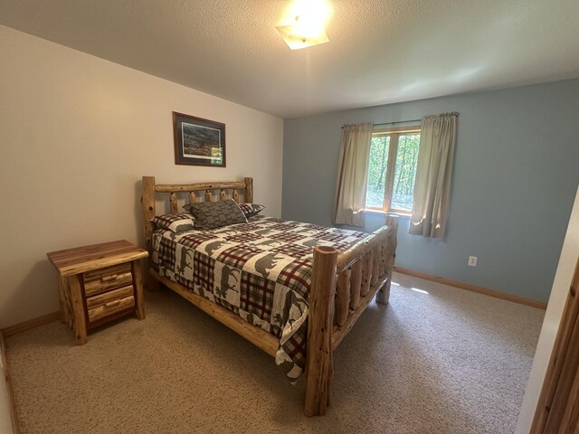 18440 Hardwood Trl, Hillman, MI 49746 - bedroom featuring carpet floors and baseboards