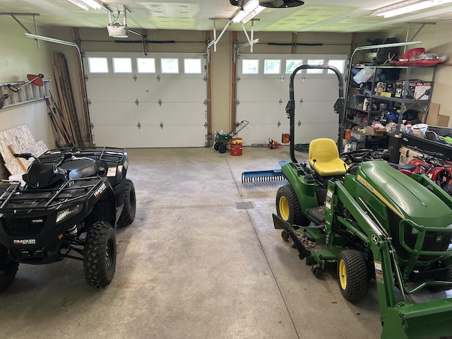 18440 Hardwood Trl, Hillman, MI 49746 - garage featuring a garage door opener