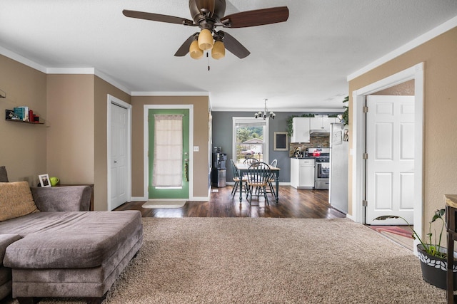 8934 Roberts Rd, Mancelona, MI 49659 - living room featuring crown molding, ceiling fan, and dark wood-style floors