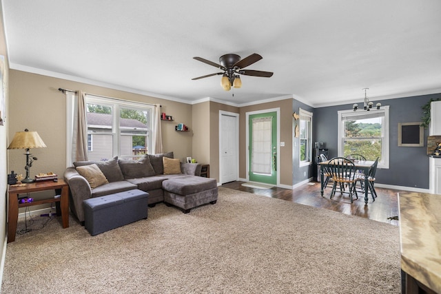 8934 Roberts Rd, Mancelona, MI 49659 - living room featuring healthy amount of natural light, wood finished floors, a ceiling fan, and crown molding