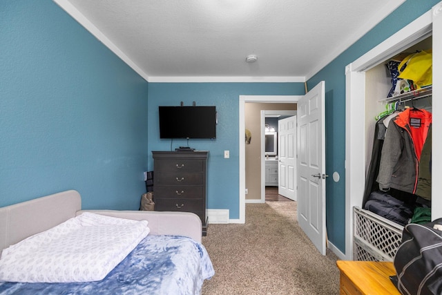 8934 Roberts Rd, Mancelona, MI 49659 - bedroom with carpet flooring, a closet, and crown molding