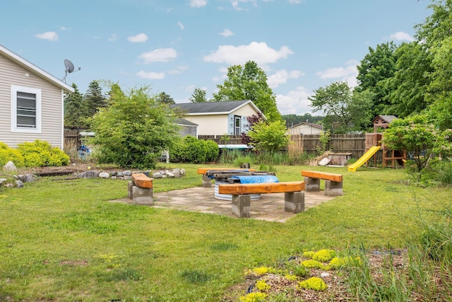 8934 Roberts Rd, Mancelona, MI 49659 - view of yard with a playground and a patio area