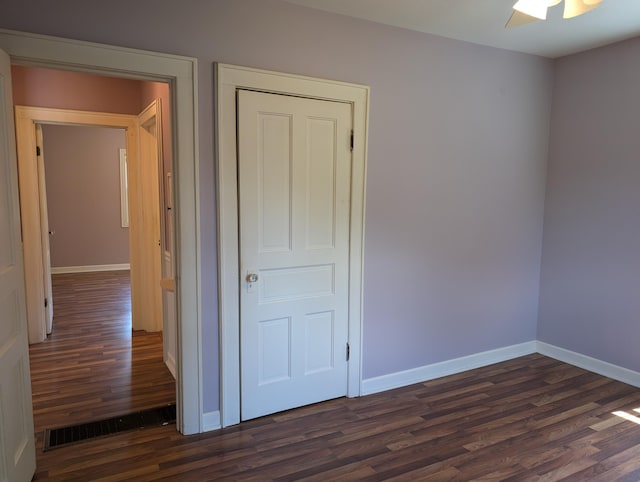 3090 S 37th Rd, Cadillac, MI 49601 - unfurnished bedroom featuring dark wood finished floors and a ceiling fan