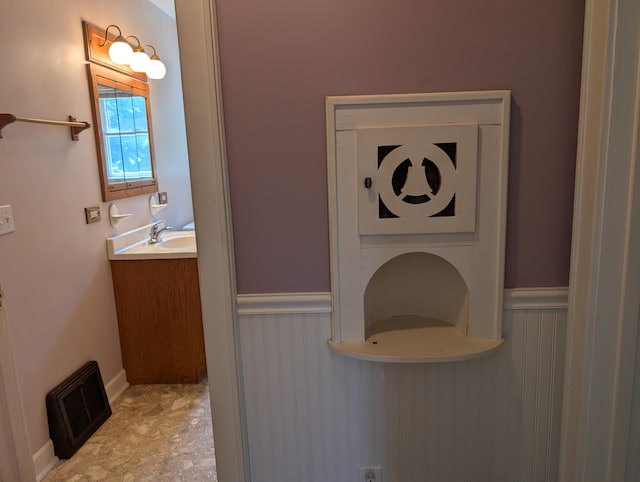 3090 S 37th Rd, Cadillac, MI 49601 - bathroom with vanity and wainscoting