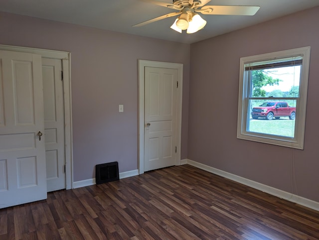 3090 S 37th Rd, Cadillac, MI 49601 - unfurnished bedroom featuring dark wood finished floors and a ceiling fan