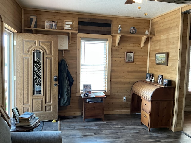 314 Sable St, Alpena, MI 49707 - home office featuring wooden walls, wood finished floors, and a ceiling fan
