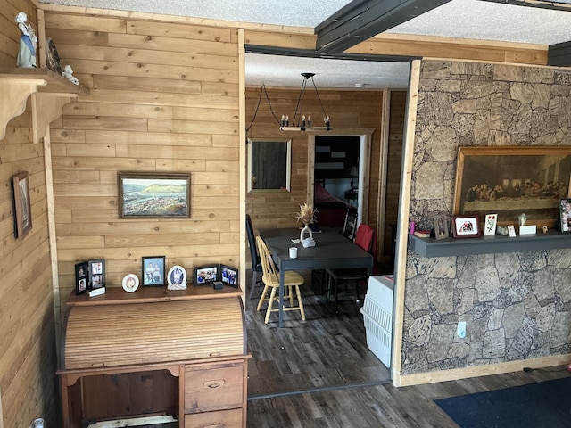 314 Sable St, Alpena, MI 49707 - bar with wood walls, dark wood-type flooring, beamed ceiling, and heating unit